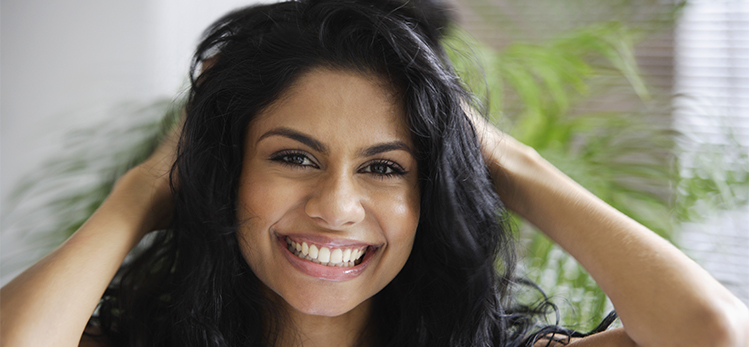 indian-woman-smiling-playing-her-hair